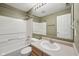 Cozy bathroom featuring a shower-tub combo, sink, and a large mirror at 513 Sun Catcher Dr, Avon, IN 46123