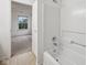Bathroom with a bathtub and shower, a tiled floor, and a view into bedroom at 513 Sun Catcher Dr, Avon, IN 46123