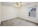 Bright bedroom with neutral carpet and a large window overlooking the exterior at 513 Sun Catcher Dr, Avon, IN 46123