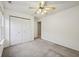 Bedroom with neutral carpet, closet, and a view to the hallway at 513 Sun Catcher Dr, Avon, IN 46123