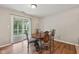 Cozy dining room features wood floors and sliding glass doors to the outdoor deck at 513 Sun Catcher Dr, Avon, IN 46123