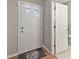 Foyer features wood-look flooring and white door leading to the bathroom at 513 Sun Catcher Dr, Avon, IN 46123