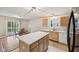 Kitchen features an island and leads to a dining area with sliding glass doors at 513 Sun Catcher Dr, Avon, IN 46123