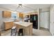 Eat-in kitchen with an island and stainless steel sink at 513 Sun Catcher Dr, Avon, IN 46123