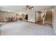 Open-concept living area with kitchen, dining space, and staircase, perfect for Gathering gatherings at 513 Sun Catcher Dr, Avon, IN 46123