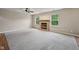 Cozy living room with a brick fireplace, providing a warm and inviting atmosphere with lots of room at 513 Sun Catcher Dr, Avon, IN 46123