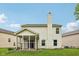 Rear view of the home features siding, well kept lawn and screened-in porch at 513 Sun Catcher Dr, Avon, IN 46123