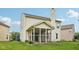 Rear exterior view highlighting siding and a screened-in porch for outdoor enjoyment at 513 Sun Catcher Dr, Avon, IN 46123