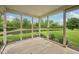 Enjoy outdoor views in the screened porch overlooking the backyard and pond at 513 Sun Catcher Dr, Avon, IN 46123