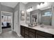 Elegant bathroom with double vanity, large mirror, and decorative lighting fixtures at 5273 Nettleton Way, Avon, IN 46123