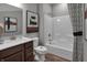 Bathroom with a shower-tub combo, modern vanity, and stylish decor for a functional and appealing space at 5273 Nettleton Way, Avon, IN 46123
