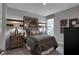 Cozy bedroom with a comfortable bed, stylish decor, and ample natural light from the window at 5273 Nettleton Way, Avon, IN 46123