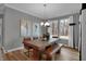 Elegant dining room with a large table, stylish chairs, and ample natural light at 5273 Nettleton Way, Avon, IN 46123