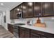 Kitchen close-up featuring stainless steel appliances, sleek cabinetry, and bright, white countertops at 5273 Nettleton Way, Avon, IN 46123