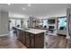 Spacious open-concept kitchen with large island, great natural light and easy access to living and dining areas at 5273 Nettleton Way, Avon, IN 46123