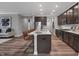Modern kitchen featuring a large island with bar seating, stainless steel appliances, and sleek cabinetry at 5273 Nettleton Way, Avon, IN 46123