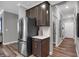 Close-up of kitchen featuring stainless steel refrigerator, stylish cabinetry, and counter space at 5273 Nettleton Way, Avon, IN 46123