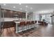 Spacious kitchen with a central island, bar stools, ample cabinetry, and an adjacent dining area at 5273 Nettleton Way, Avon, IN 46123