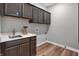 Functional laundry room with ample cabinet space, sleek countertops, and modern fixtures at 5273 Nettleton Way, Avon, IN 46123
