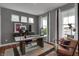 Comfortable home office featuring a large desk, neutral decor, and a chair for relaxing at 5273 Nettleton Way, Avon, IN 46123
