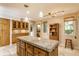 Spacious kitchen with custom wood cabinets and granite island countertop, ample counterspace, and natural light at 5326 White Marsh Ln, Indianapolis, IN 46226