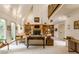 Bright living room featuring a fireplace with built-in bookshelves and large windows with natural light and neutral colors at 5326 White Marsh Ln, Indianapolis, IN 46226