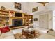 Bright living room featuring a fireplace with built-in bookshelves and neutral color palettes at 5326 White Marsh Ln, Indianapolis, IN 46226