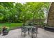 Outdoor patio with wrought iron furniture, landscaping, and outdoor grill at 5326 White Marsh Ln, Indianapolis, IN 46226