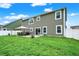 Large backyard with patio, dining area and lush green lawn at 5420 Orwell Ct, Indianapolis, IN 46239