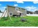 Backyard featuring a trampoline, swing set, patio, and plenty of space for outdoor fun at 5420 Orwell Ct, Indianapolis, IN 46239