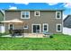 Spacious backyard featuring a patio with seating and plenty of green space at 5420 Orwell Ct, Indianapolis, IN 46239