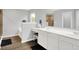 Bright bathroom featuring dual sinks, modern vanity, and a separate shower and tub at 5420 Orwell Ct, Indianapolis, IN 46239