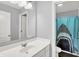 Charming bathroom featuring a vanity and a fun shark-themed shower curtain at 5420 Orwell Ct, Indianapolis, IN 46239