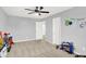Carpeted ' bedroom with ceiling fan and neutral paint at 5420 Orwell Ct, Indianapolis, IN 46239