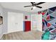 This bedroom has closet and storage space, a view of the wall, and a geometric accent wall at 5420 Orwell Ct, Indianapolis, IN 46239