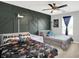 bedroom with two twin beds, themed bedding and geometric accent wall at 5420 Orwell Ct, Indianapolis, IN 46239