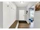 Welcoming entryway featuring built-in bench and coat rack, and hardwood flooring at 5420 Orwell Ct, Indianapolis, IN 46239