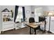 Bright home office space with stylish desk and ample natural light, perfect for remote work or study at 5420 Orwell Ct, Indianapolis, IN 46239