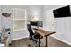 Well-lit home office with unique wood desk, perfect for productivity and comfortable remote work at 5420 Orwell Ct, Indianapolis, IN 46239