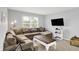 Relaxing living room with comfortable sectional, and a bright window for natural light at 5420 Orwell Ct, Indianapolis, IN 46239