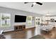 Spacious living room with hardwood floors, a view of the kitchen, and a dining area at 5420 Orwell Ct, Indianapolis, IN 46239