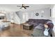Open-concept living room with hardwood floors, neutral decor, and plenty of seating at 5420 Orwell Ct, Indianapolis, IN 46239