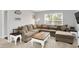 Spacious living room with sectional sofa, a cozy and inviting atmosphere for relaxation and entertainment at 5420 Orwell Ct, Indianapolis, IN 46239