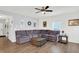 Comfortable living room with hardwood floors and a plush sectional sofa at 5420 Orwell Ct, Indianapolis, IN 46239