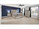 Stunning main bedroom with elegant furnishings, including a large bed and stylish dresser at 5420 Orwell Ct, Indianapolis, IN 46239
