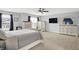 This main bedroom features carpet, ceiling fan, and multiple dressers for ample storage at 5420 Orwell Ct, Indianapolis, IN 46239