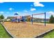 Community playground with colorful play structure, swings, and a cushioned ground cover, perfect for  at 5420 Orwell Ct, Indianapolis, IN 46239
