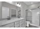 Bathroom features a double sink vanity with a tiled shower with glass door at 633 Bridgeman Rd, Avon, IN 46123