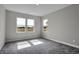 Bedroom features multiple windows letting in natural light and plush gray carpeting at 633 Bridgeman Rd, Avon, IN 46123