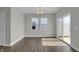 Dining room features a chandelier, large windows, and sliding glass door to the patio at 633 Bridgeman Rd, Avon, IN 46123